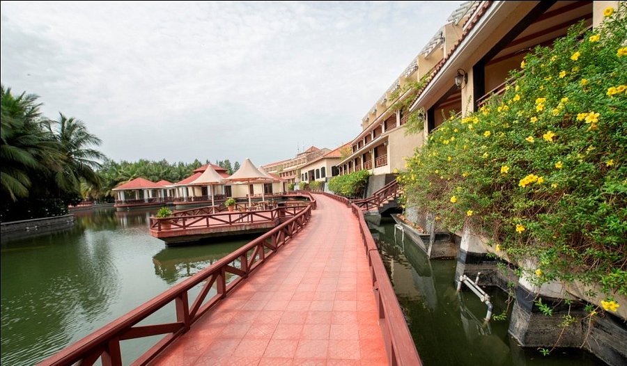 Aerial view of the lagoon pool and luxury villas at Ocean Spray Resort Pondicherry, the setting for the JioHotstar series.